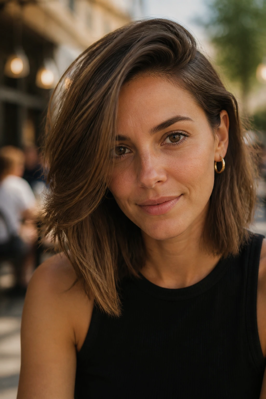 Portrait of a real woman with a deep side-part lob and crown lift in natural light