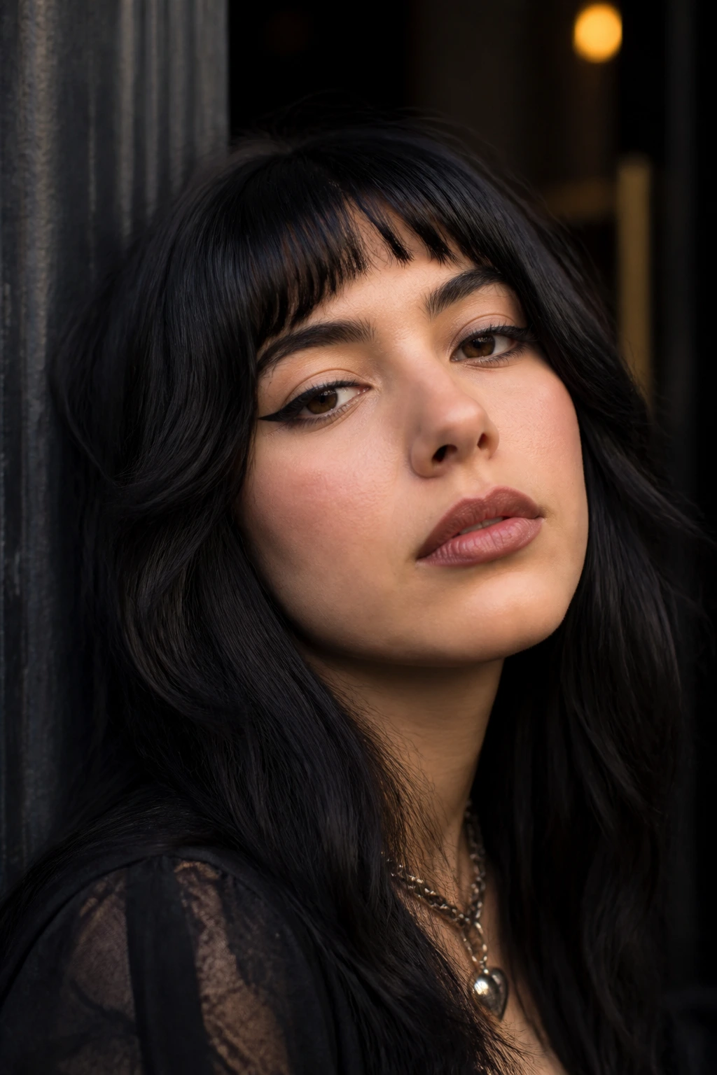 Latina woman with half-moon fringe framing her eyes