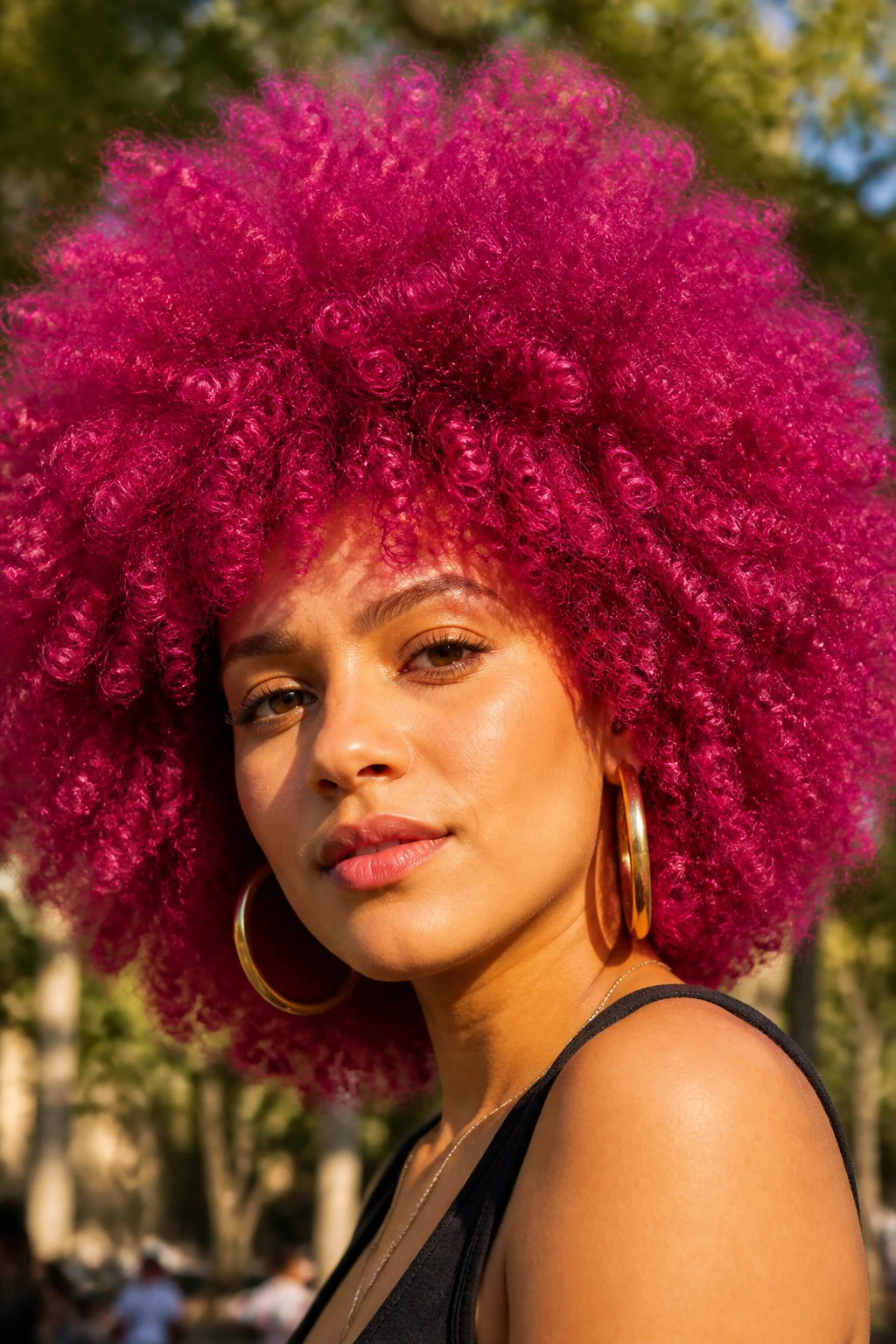 Close-up of a real person with a vibrant magenta Afro
