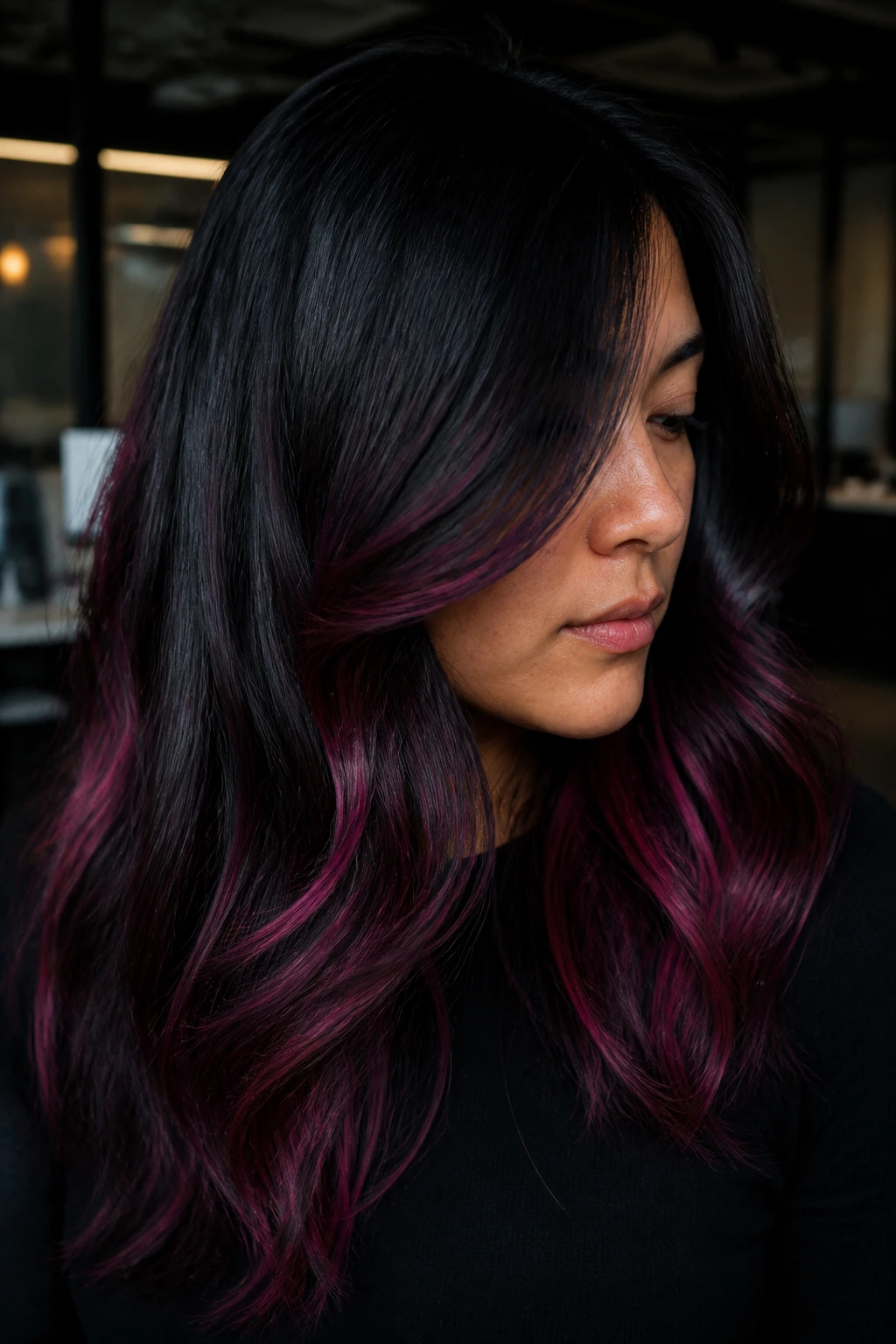 Close-up of black hair with subtle deep pink highlights in Midnight Rose Blend