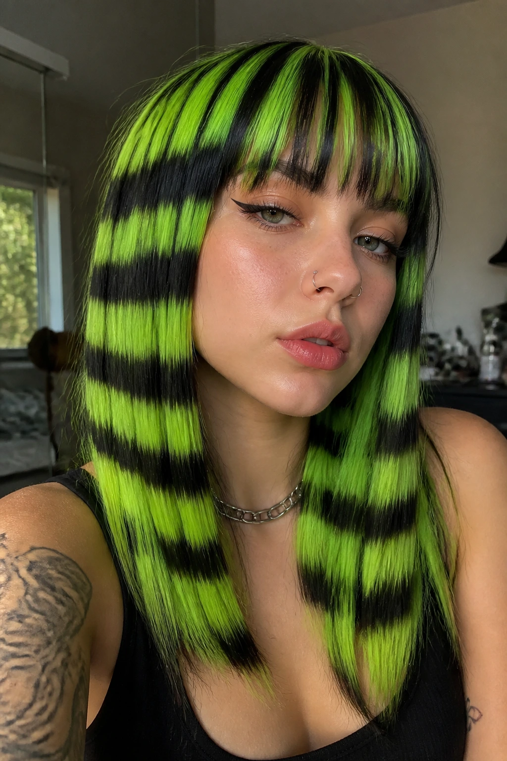 Close-up of a real person with neon green and black striped highlights on straight hair