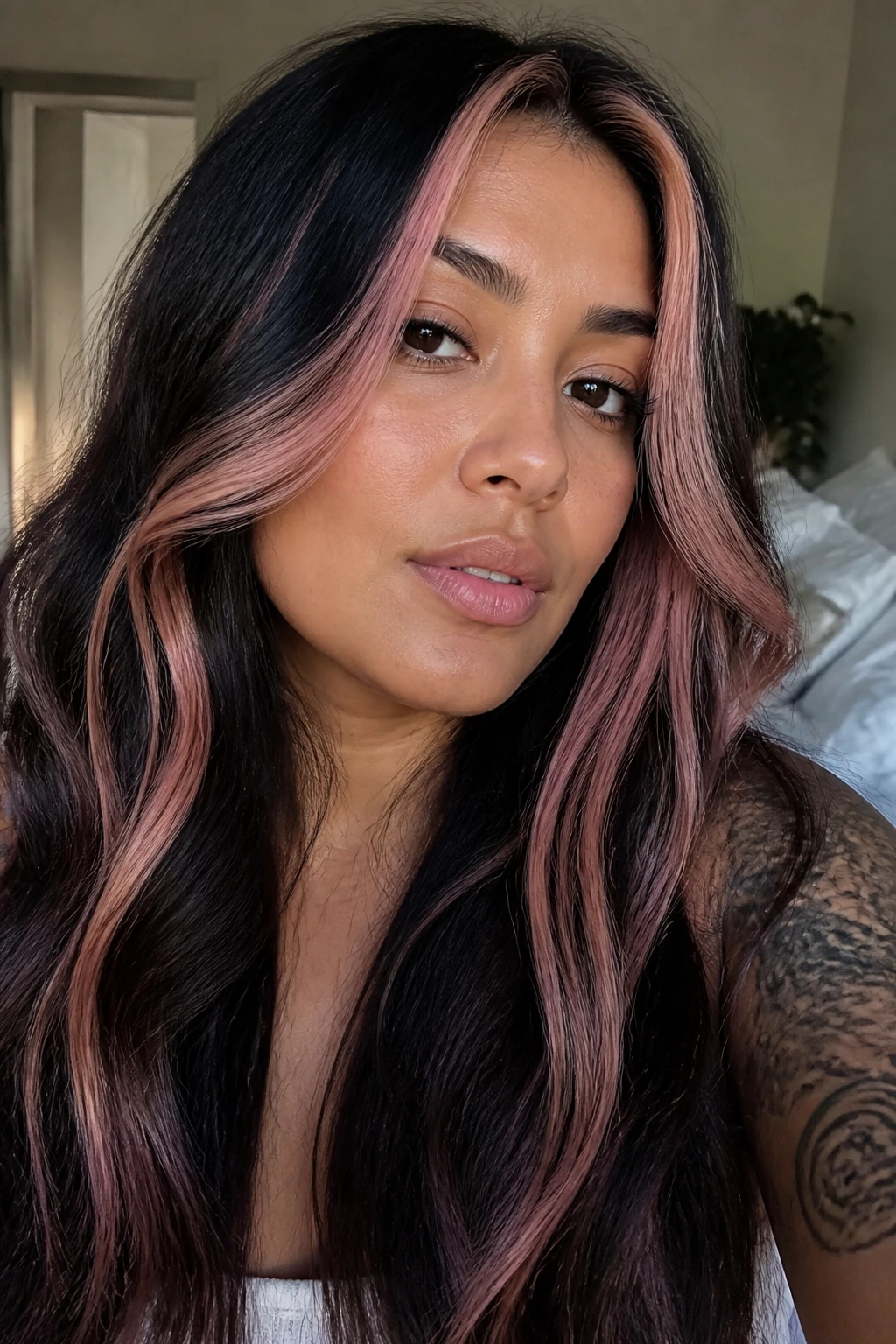 Close-up of a real woman with nude pink ribbon highlights in dark hair