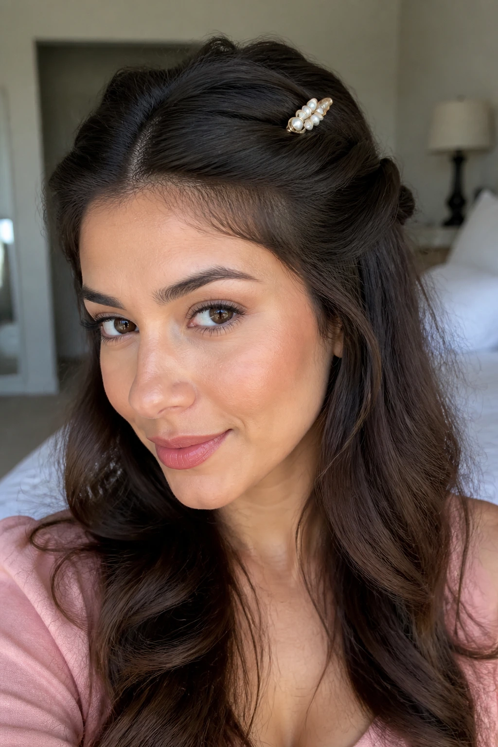 Real woman with a crown-like pin-back hairstyle secured by a decorative barrette
