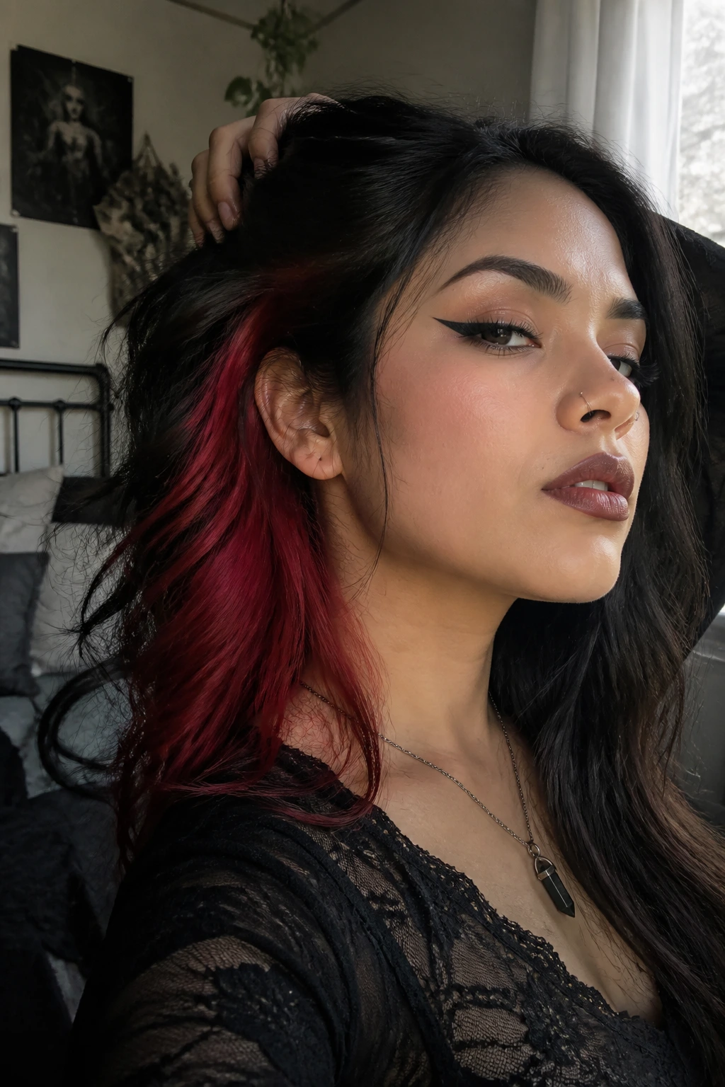 Close-up of Latina woman with ruby red under-layers visible under dark top layer