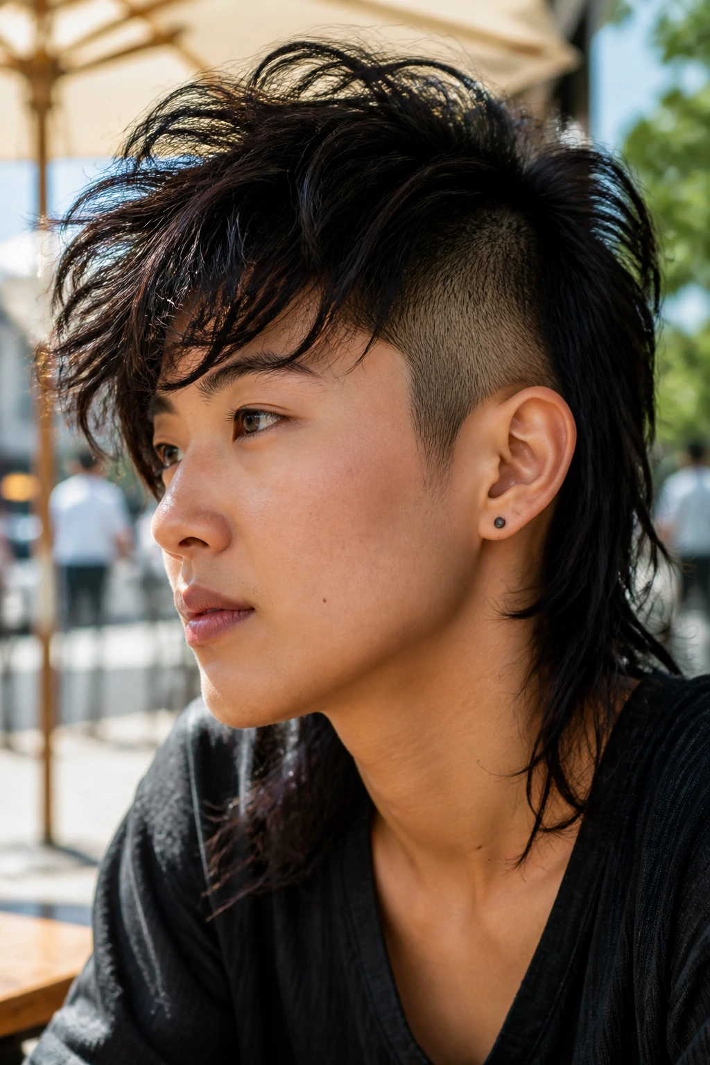 Close-up of an Asian person showing a textured shag undercut with tousled long layers.